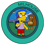 An angry Milhouse wearing a blue backpack and outside pointing down at the grass while his classmate, Lewis is in the background looking on